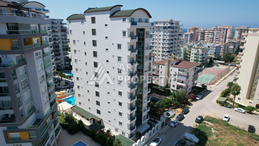 Светлые апартаменты 1+1 в премиальном комплексе района Махмутлар - Ракурс 2