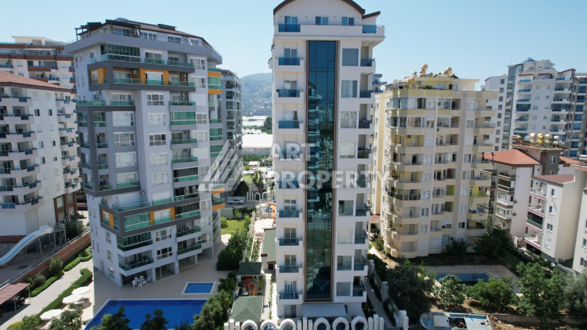 Светлые апартаменты 1+1 в премиальном комплексе района Махмутлар - Ракурс 3