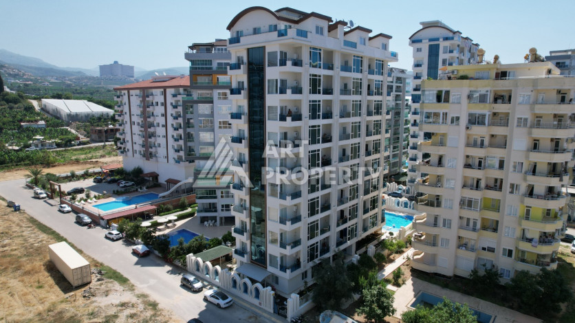 Светлые апартаменты 1+1 в премиальном комплексе района Махмутлар - Ракурс 4