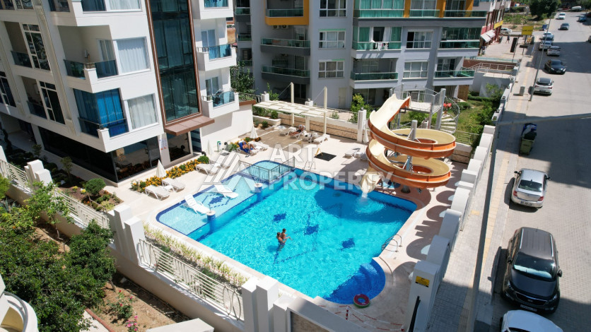 Светлые апартаменты 1+1 в премиальном комплексе района Махмутлар - Ракурс 8