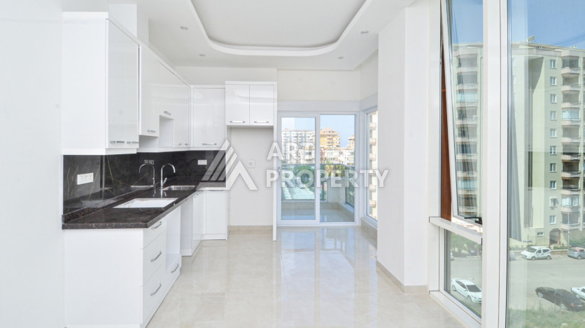 Светлые апартаменты 1+1 в премиальном комплексе района Махмутлар - Ракурс 9