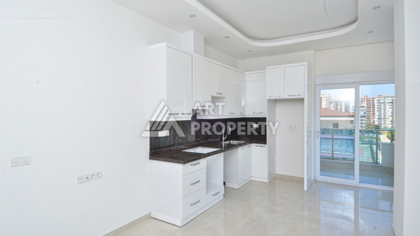 Светлые апартаменты 1+1 в премиальном комплексе района Махмутлар - Ракурс 11