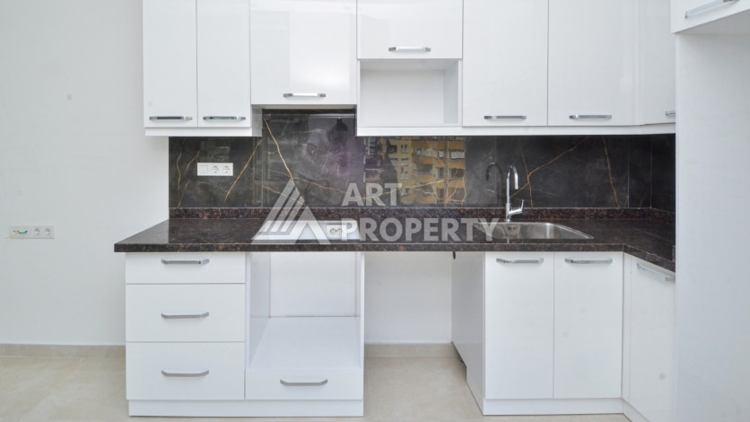 Светлые апартаменты 1+1 в премиальном комплексе района Махмутлар - Ракурс 12