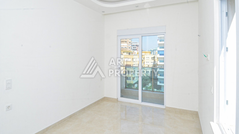 Светлые апартаменты 1+1 в премиальном комплексе района Махмутлар - Ракурс 19