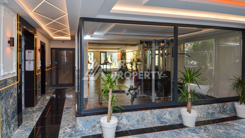 Светлые апартаменты 1+1 в премиальном комплексе района Махмутлар - Ракурс 24