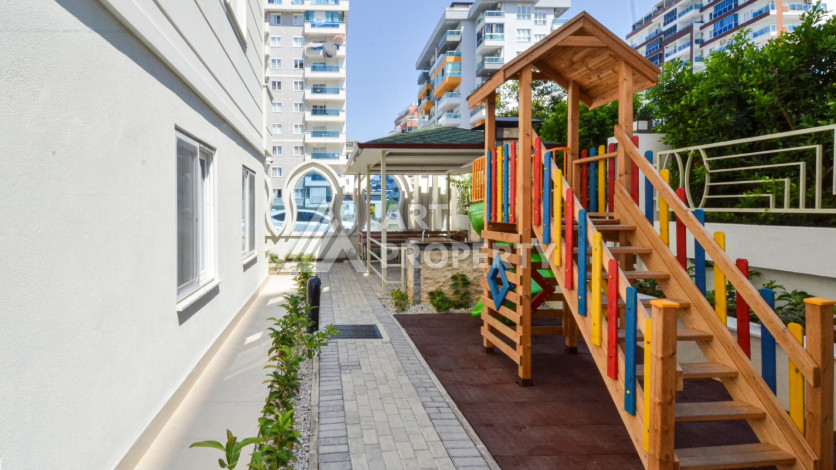 Светлые апартаменты 1+1 в премиальном комплексе района Махмутлар - Ракурс 28