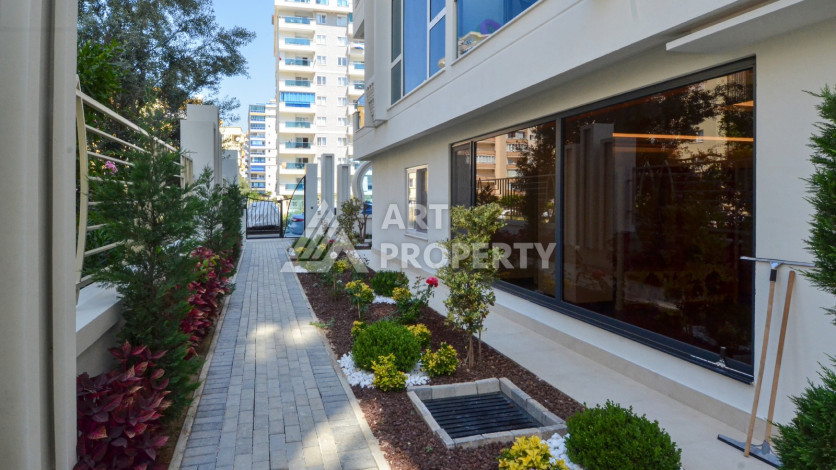 Светлые апартаменты 1+1 в премиальном комплексе района Махмутлар - Ракурс 29