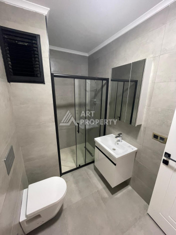 Качественные апартаменты 1+1 в стильном проекте района Махмутлар - Ракурс 19