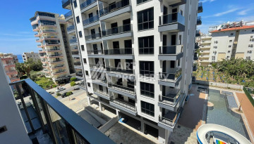 Качественные апартаменты 1+1 в стильном новом комплексе района Махмутлар - Ракурс 2