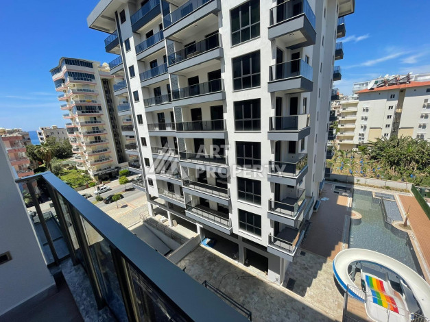Качественные апартаменты 1+1 в стильном новом комплексе района Махмутлар - Ракурс 1