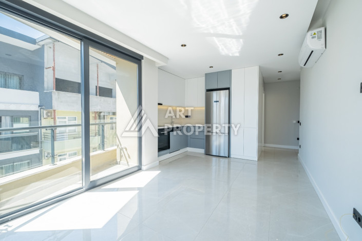 Стильные апартаменты 1+1 в районе пляжа Клеопатра центр Алании - Ракурс 9