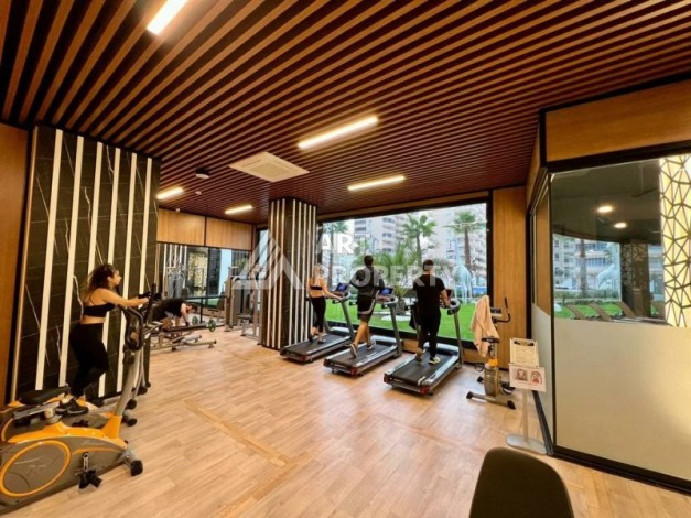 Квартира 1+1 в знаменитом премиальном комплексе в районе Махмутлар - Ракурс 3