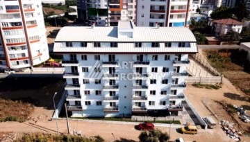 Квартира 1+1 в тихом месте со своей инфраструктурой в районе Махмутлар - Ракурс 1