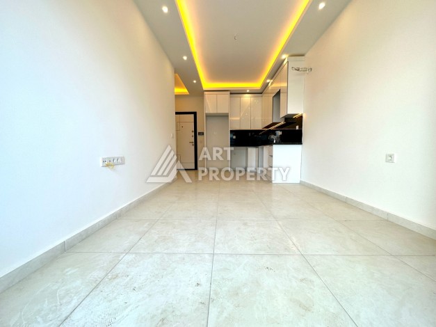 Видовая квартира 1+1 в комплексе с полной инфраструктурой развитого района Махмутлар - Ракурс 8