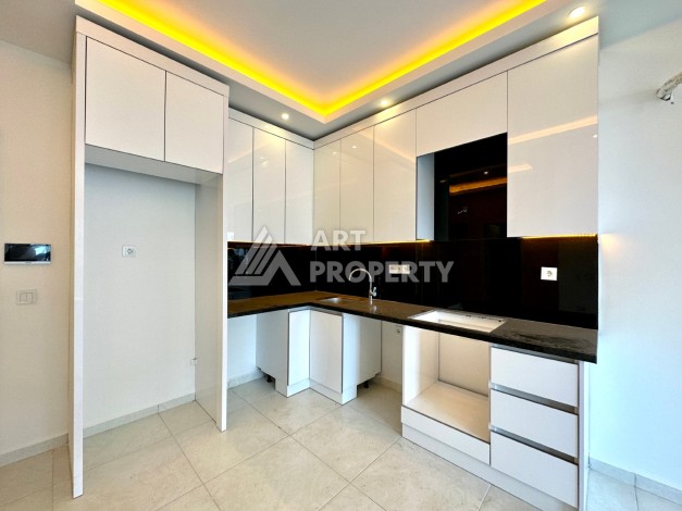 Видовая квартира 1+1 в комплексе с полной инфраструктурой развитого района Махмутлар - Ракурс 9