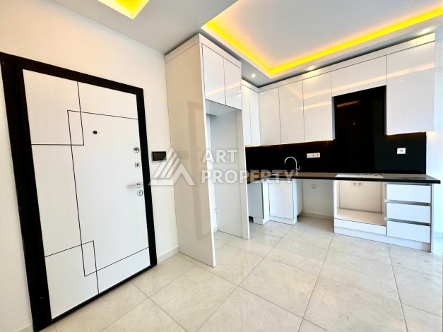 Видовая квартира 1+1 в комплексе с полной инфраструктурой развитого района Махмутлар - Ракурс 11