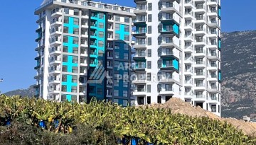 Великолепные апартаменты 3+1 в комплексе с пятизвездочной инфраструктурой развитого района Махмутлар - Ракурс 1