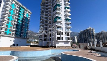 Великолепные апартаменты 3+1 в комплексе с пятизвездочной инфраструктурой развитого района Махмутлар - Ракурс 5