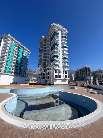 Великолепные апартаменты 3+1 в комплексе с пятизвездочной инфраструктурой развитого района Махмутлар - Ракурс 4