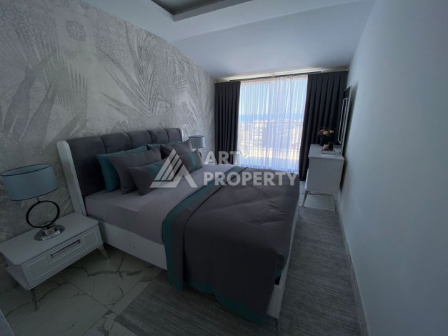 Великолепные апартаменты 3+1 в комплексе с пятизвездочной инфраструктурой развитого района Махмутлар - Ракурс 12