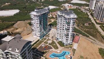 Великолепные апартаменты 3+1 в комплексе с пятизвездочной инфраструктурой развитого района Махмутлар - Ракурс 3