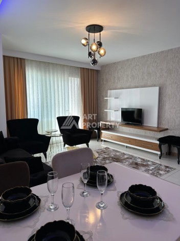 Апартаменты 1+1 с дизайнерским ремонтом и мебелью в качественном комплексе развитого района Махмутлар - Ракурс 2