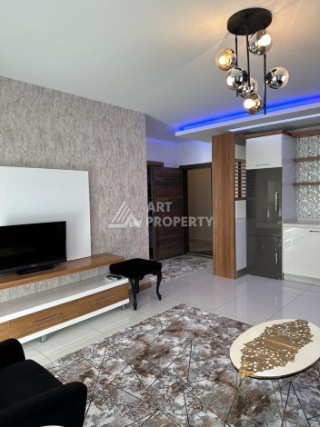 Апартаменты 1+1 с дизайнерским ремонтом и мебелью в качественном комплексе развитого района Махмутлар - Ракурс 4