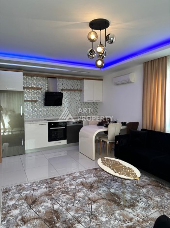 Апартаменты 1+1 с дизайнерским ремонтом и мебелью в качественном комплексе развитого района Махмутлар - Ракурс 7