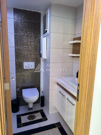 Апартаменты 1+1 с дизайнерским ремонтом и мебелью в качественном комплексе развитого района Махмутлар - Ракурс 14