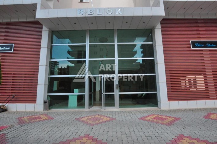 Апартаменты 1+1 с дизайнерским ремонтом и мебелью в качественном комплексе развитого района Махмутлар - Ракурс 18