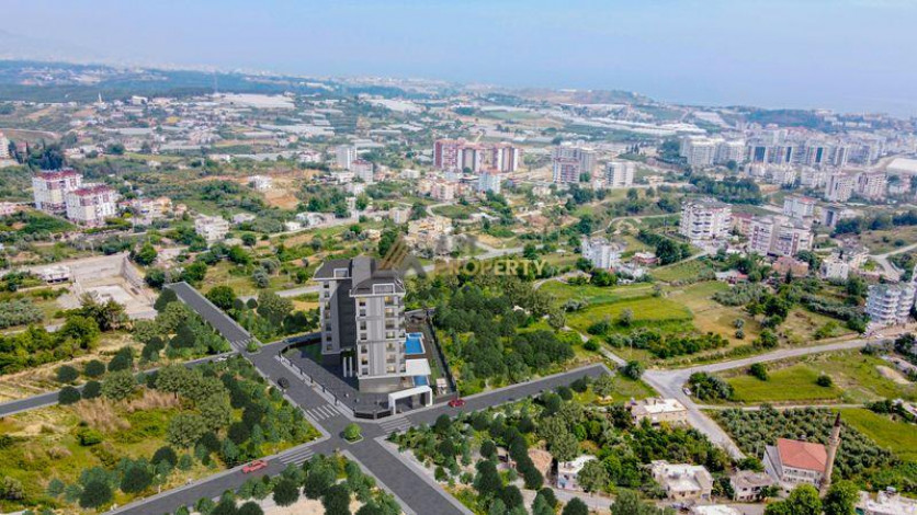 Инвестиционный проект на стадии строительства. Квартиры 1+1, 2+1 и 3+1 пентхаусы по стартовым ценам! Авсаллар, Алания. - Ракурс 6