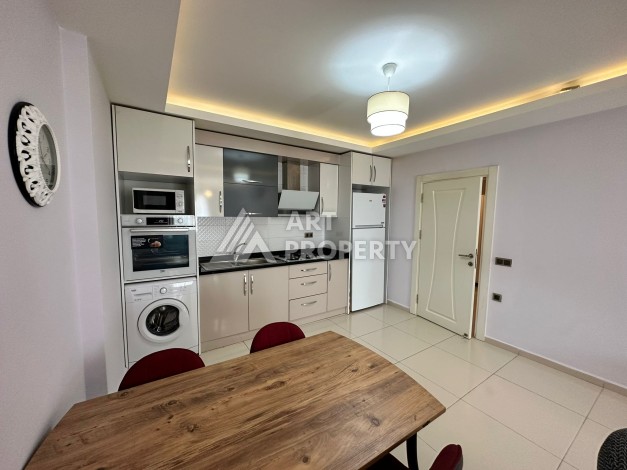 Просторная 1+1 с большой планировкой в комплексе бизнес класса в развитом районе Махмутлар - Ракурс 28