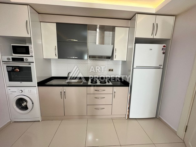 Просторная 1+1 с большой планировкой в комплексе бизнес класса в развитом районе Махмутлар - Ракурс 33