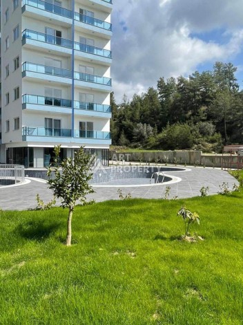 Новые апартаменты 1+1 в комплексе с инфраструктурой класса люкс в зеленом районе Авсаллар - Ракурс 1