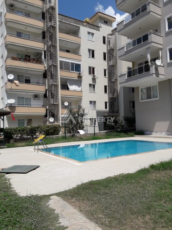 Видовые апартаменты 2+1 в развитом районе Махмутлар - Ракурс 17