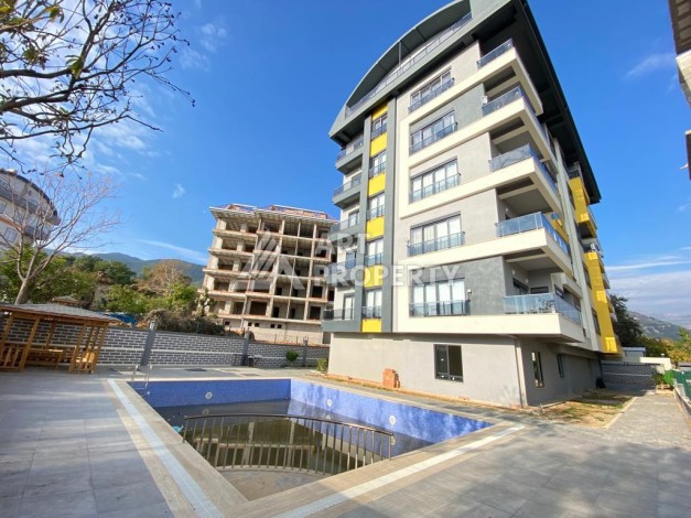 Новые апартаменты 2+1 в комплексе района Алании Чиплаклы - Ракурс 1