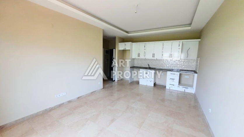 Новые апартаменты 1+1 в комплексе с инфраструктурой в элитном районе Алании Каргыджак - Ракурс 4