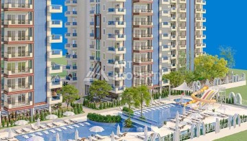 Выгодные под инвестиции апартаменты в строящемся комплексе комфорт класса в развитом районе Махмутлар - Ракурс 2