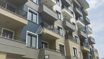 Новые апартаменты 1+1 в комплексе с инфраструктурой развитого района Махмутлар - Ракурс 1