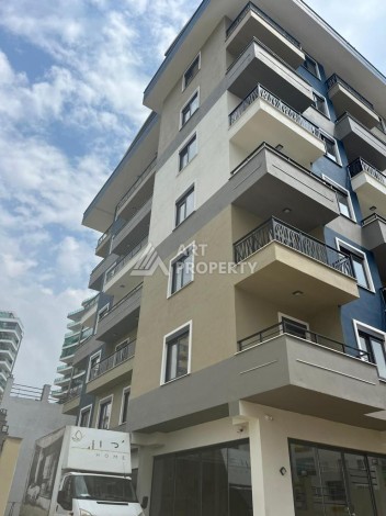 Новые апартаменты 1+1 в комплексе с инфраструктурой развитого района Махмутлар - Ракурс 1