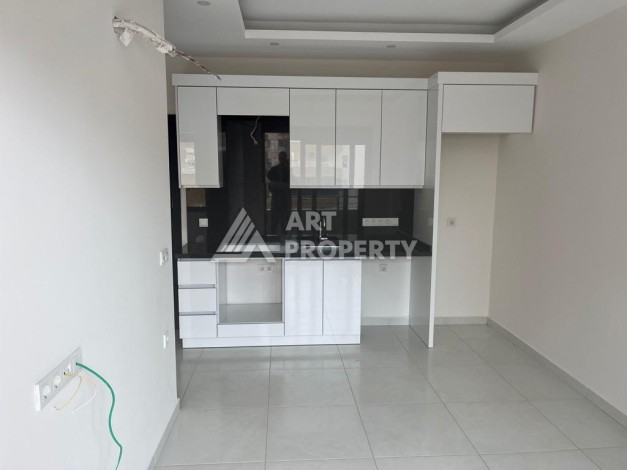 Новые апартаменты 1+1 в комплексе с инфраструктурой развитого района Махмутлар - Ракурс 3