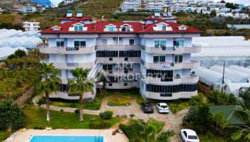 Просторные апартаменты 2+1 в уютном комплексе в близи от моря в зеленом районе Демирташ - Ракурс 1