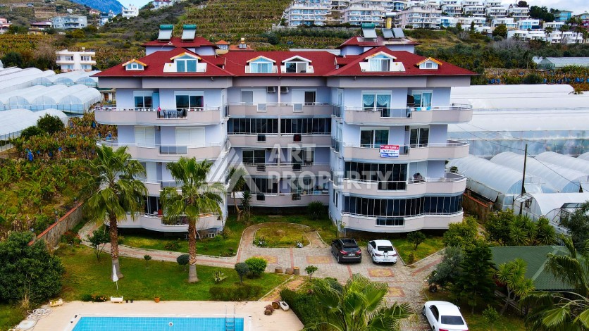 Просторные апартаменты 2+1 в уютном комплексе в близи от моря в зеленом районе Демирташ - Ракурс 0