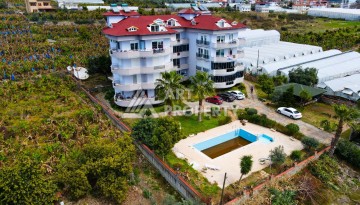 Просторные апартаменты 2+1 в уютном комплексе в близи от моря в зеленом районе Демирташ - Ракурс 14