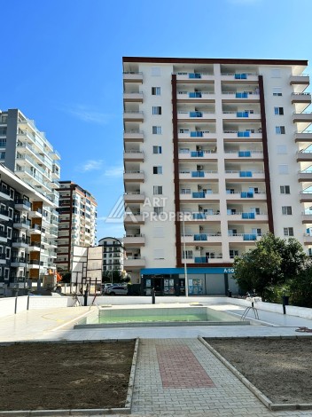 Бюджетная квартира 1+1 в новом комплексе в Махмутларе в 400 м от моря! - Ракурс 9