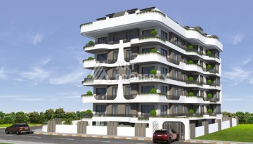 Апартаменты 1+1 на этапе строительства в комфортном комплексе развитого района Махмутлар - Ракурс 1