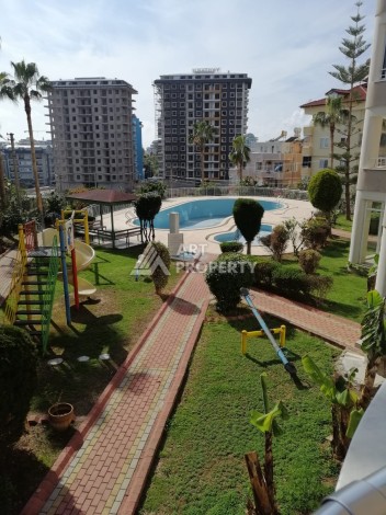 Просторная квартира 2+1 в развитом районе Махмутлар рядом с морем - Ракурс 7