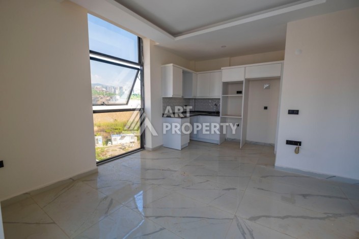 Просторная квартира 1+1 в популярном районе Махмутлар - Ракурс 9