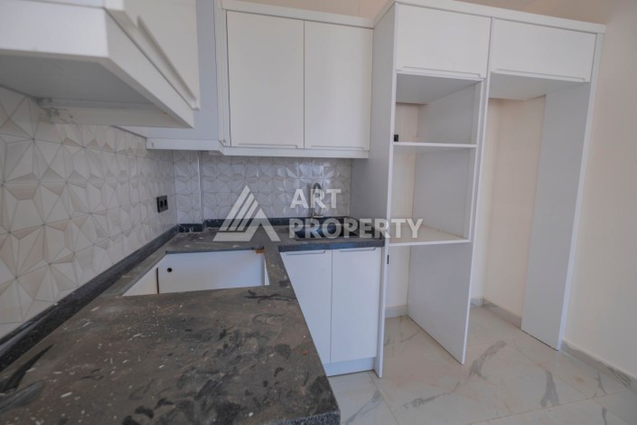 Просторная квартира 1+1 в популярном районе Махмутлар - Ракурс 12