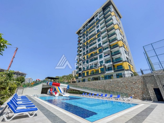 Уютная квартира 1+1 в хорошем комплексе от надежного застройщика в районе Махмутлар - Ракурс 2